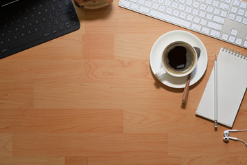 Office wooden desk table with computer, coffee cup and copy space