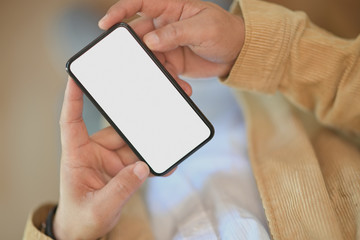 Top view of Man standing and using mobile smart phone