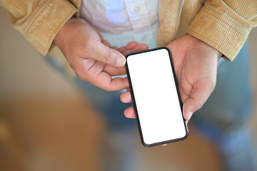 Top view of Man standing and using mobile smart phone