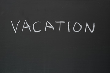 Vacation Written On Blackboard