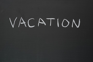 Obraz premium Vacation Written On Blackboard