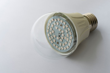 Led lamp with cap close-up. The lamp visible LEDs square shape.  The background of the image is white.