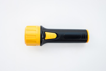 Yellow LED flashlight for emergency on white background 