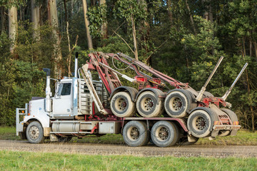Convertible logging truck on a road in country Victoria, Australia