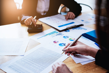 Two Happy businesswoman discuss about marketing report.