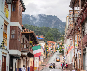 A view of a typical colonial style street in La Candelaria neighborhood, Bogota, Colombia.
