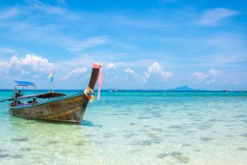 A Thai long tail boat on the beach of Andaman sea located at Krabi near Phuket, Thailand