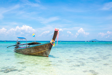 Fototapeta na wymiar A Thai long tail boat on the beach of Andaman sea located at Krabi near Phuket, Thailand