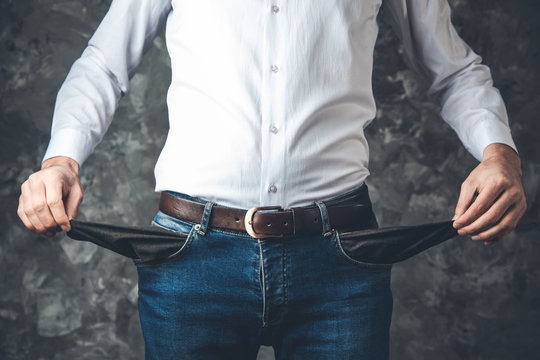 Man Hand Empty Pocket On Dark Background