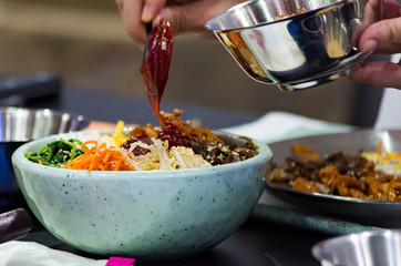 Bibimbap, Traditional Korean cusine bibimbap, Chef preparing Korean food, chef cooking in kitchen