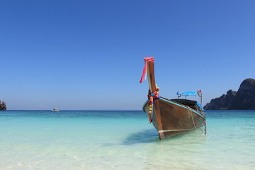 Long tail boat and tropical beach on Phi Phi island Thailand 