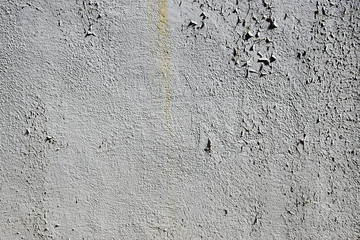 Rough white stone wall with peeling paint grunge vintage texture background
