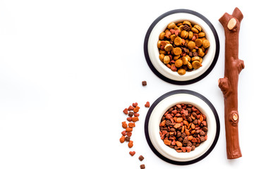 Animal food in bowl on white background top view copy space