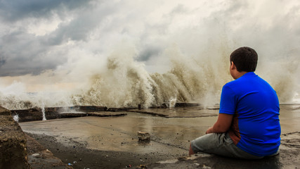 Storm waves over a pier in the Adler, Sochi