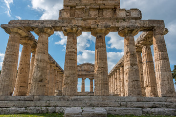 Obraz premium Ancient Greek Temple in the Ruins of a Village in Southern Italy