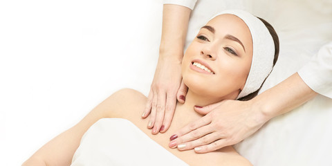 Fototapeta na wymiar Facial salon massage. Woman professional therapy. Hands at neck. Healthy cosmetic procedure. Luxury spa treatment