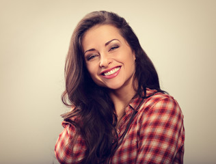Beautiful natural makeup toothy smiling woman with long hair style. Closeup portrait