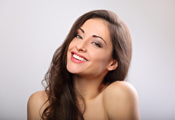 Beautiful natural makeup woman smiling with long hair style. Skincare concept. Closeup portrait on blue background