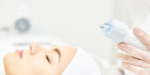 Facial skincare medical spa therapy. Beauty woman face cleaning. Specialist aesthetics ultra sound...