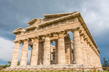 Obraz premium Ancient Greek Temple in the Ruins of a Village in Southern Italy