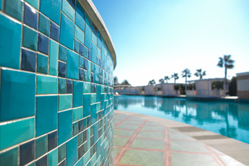 Open air swimming pool blue surface background in hotel