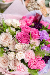 ombre of color. beautiful fresh cut bouquet of mixed flowers. the work of the florist at a flower shop. Delicate Pastel tones color