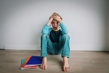 kid having too much homework, boy shouting not willing to do exercises