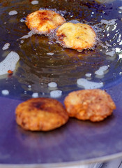 closeup View of deep frying in pan and oil Indian street food vegetable cutlets 