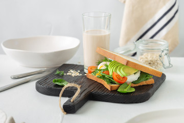 Healthy breakfast oat milk Sandwich poached eggs