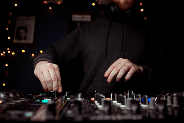 DJ playing music at mixer closeup