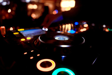 DJ playing music at mixer closeup