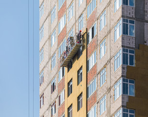 Facade work and insulation of a multistory building