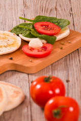 Tigella bread with spinach and tomatoes.