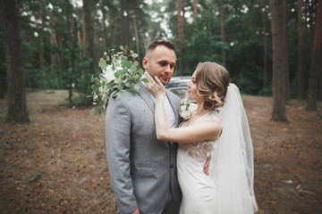 Caucasian happy romantic young couple celebrating their marriage. Outdoor