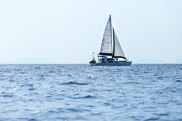 Obraz premium Sailing ship luxury yacht with white sails in the Sea.