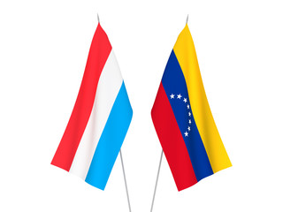 National fabric flags of Venezuela and Luxembourg isolated on white background. 3d rendering illustration.