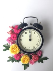 alarm clock and flowers