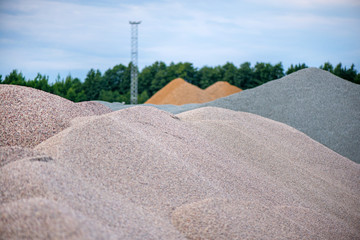 Large piles of construction sand and gravel used for asphalt production and building. Limestone...