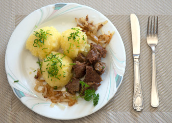 traditional Bavarian German food dumpling with red cabbage and mushrooms is tasty and appetizing in the kitchen