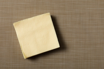 Paper napkin on textured background.
