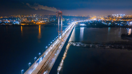 Naklejka premium aerial night city view and traffic cars. Drone shot