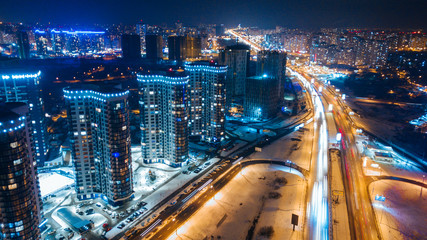 Fototapeta na wymiar aerial night city view and traffic cars. Drone shot