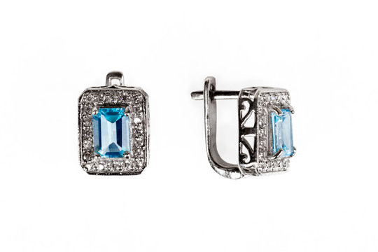 Pair of sapphire earrings isolated on white