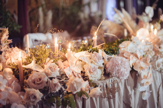 rustic wedding decorations with flowers and candles. banquet decor. picture with soft focus