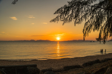 sunset at Kwang beach or deer beach there have a small island name Kwang island in the middle of Kwang beach in Krabi Thailand
