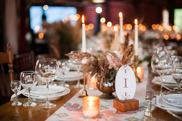 rustic wedding decorations with flowers and candles. banquet decor. picture with soft focus