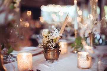 rustic wedding decorations with flowers and candles. banquet decor. picture with soft focus