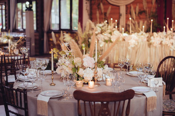 Fototapeta na wymiar rustic wedding decorations with flowers and candles. banquet decor. picture with soft focus