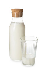 Glass and bottle of tasty fresh milk on white background
