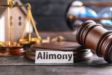 Judge's gavel and paper with text ALIMONY on table